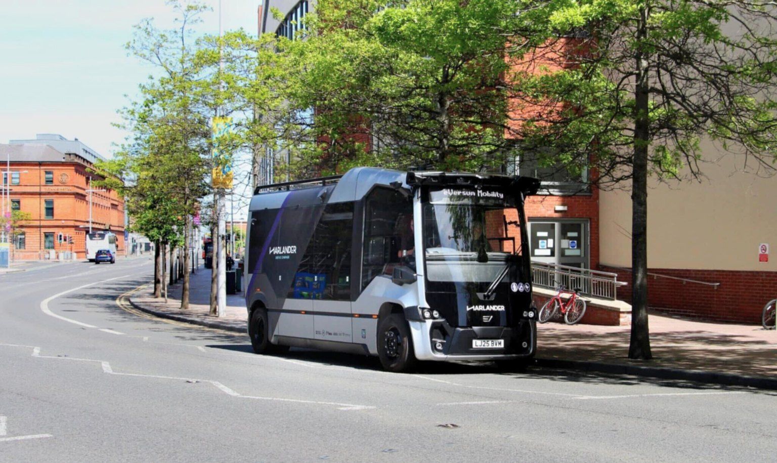 A photo of a Harlander shuttle, Northern Ireland’s first autonomous passenger vehicle, driven by Oxa.